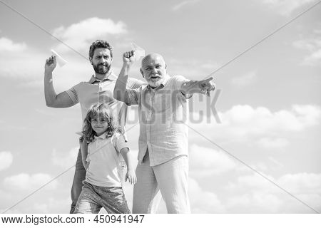 Men Generation: Grandfather Father And Grandson Playing With Toy Plane Outdoor On Sky. Boy Dreams Of