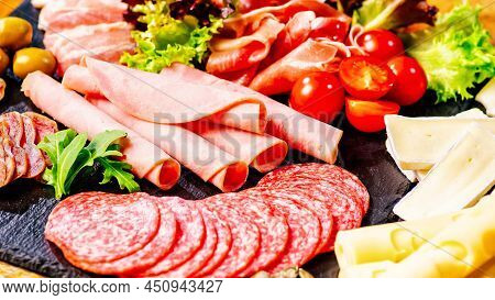 Slices Of Delicious Spanish Sausage Salami. Healthy Food Concept.assortment Of Salami Prosciutto Mea