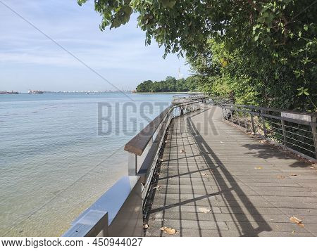 Singapore Dec 29 2021: View Of Bukit Chermin Boardwalk In Singapore. It Is Built On The Sea Along Th
