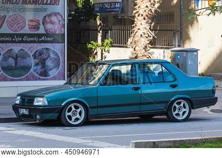 Side; Turkey - March 05 2022:   Blue Tofas Dogan Parked On The Street On A Warm Summer Day