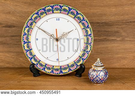 Closeup View Of Colorful Benjarong Clock And Benjarong  Jar, The Famous Souvenir From Thailand On Wo