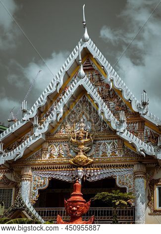 Bangkok, Thailand. Mar - 12, 2022 : Stucco Figure The Red Giant Standing Guardian At The Entrance Of
