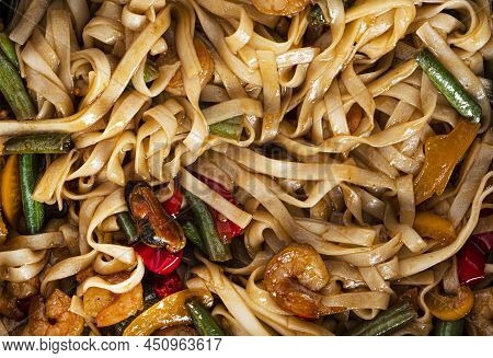 Wok Noodles With Seafood. Pasta With Shrimp And Mussels.