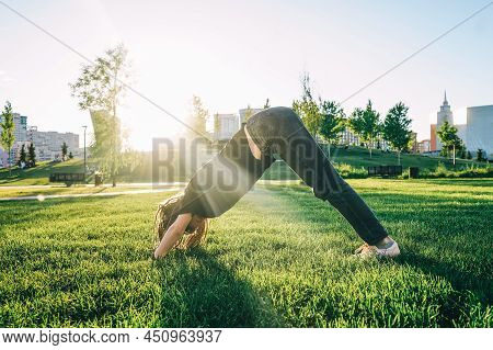 Woman In Park On Green Grass, Sunny Day.