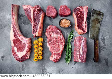 Raw Beef Meat Steaks Set, Tomahawk, T Bone, Club Steak, Rib Eye And Tenderloin Cuts, On Gray Stone B