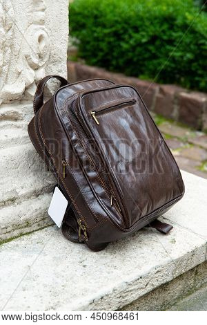 Brown Leather Backpack On The Snone Monument