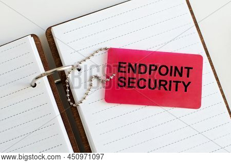 Endpoint Security Text On A Red Card On A Notepad On The Table