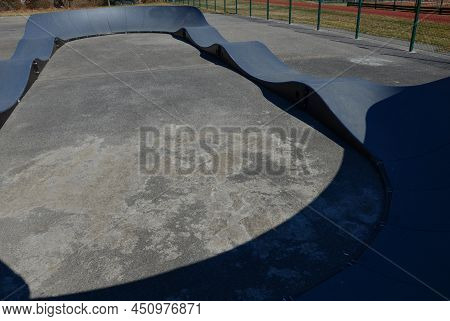 Bike Path In The Car Park Pumping (moving Up And Down) Is Used Instead Of Pedaling And Bouncing To M