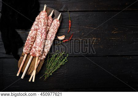 Raw Lula Kebab, Lyulya-kebab Minced Meat, Shish Kebab Ready To Cook  Set, On Black Wooden Table Back