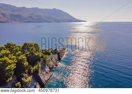 Picturesque Sea Adriatic Coast Of Montenegro. Turquoise Mediteran Sea And Rocky Shore With Evergreen
