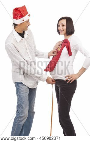 Funny Playful Dreaming Caucasian Couple With Pregnant Brunette Woman And Handsome Husband In Santa H