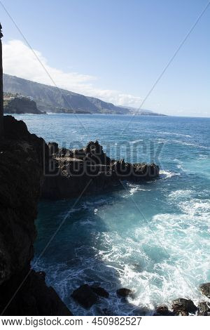 View On Black Lava Rocks In Small Village Punta Brava Near Puerto De La Cruz, Tenerife, Canary Islan