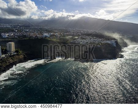 Aerial View On Black Lava Rocks And Atlantic Ocean In Small Fisherman Village Punta Brava Near Puert