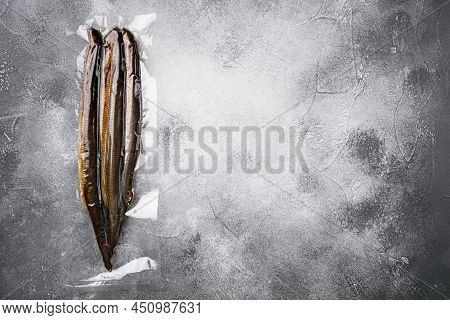 Fried River Lamprey Vacuum Pack Set, On Gray Stone Table Background, Top View Flat Lay, With Copy Sp