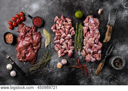 Raw Liver Chicken Offals Hearts Gizzards Meat Set, On Black Dark Stone Table Background, Top View Fl
