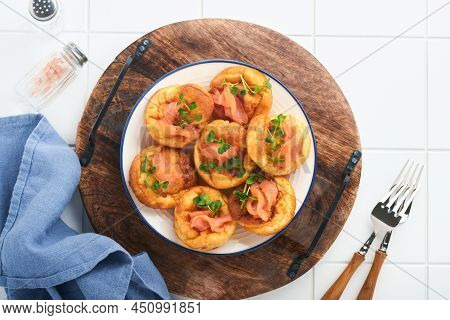 Yorkshire Pudding. Traditional English Yorkshire Pudding With Salmon And Radish Microgreens Side Dis