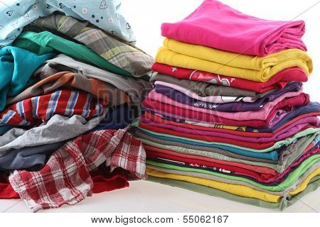 Pile Of Messy And Ironed Clothes