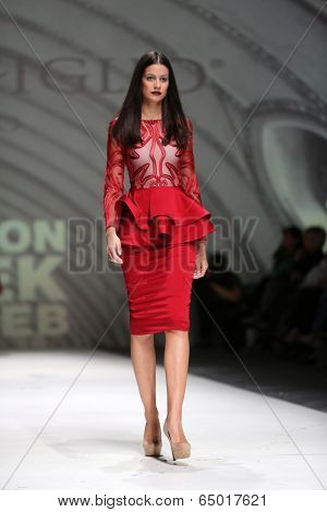 ZAGREB, CROATIA - MAY 09: Fashion model wearing clothes designed by Avaro Figlio on the Zagreb Fashion Week on May 09, 2014 in Zagreb, Croatia.