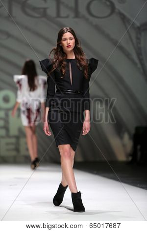 ZAGREB, CROATIA - MAY 09: Fashion model wearing clothes designed by Avaro Figlio on the Zagreb Fashion Week on May 09, 2014 in Zagreb, Croatia.