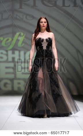 ZAGREB, CROATIA - MAY 09: Fashion model wearing clothes designed by Avaro Figlio on the Zagreb Fashion Week on May 09, 2014 in Zagreb, Croatia.