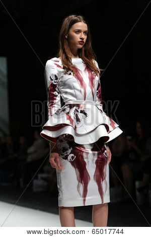 ZAGREB, CROATIA - MAY 09: Fashion model wearing clothes designed by Avaro Figlio on the Zagreb Fashion Week on May 09, 2014 in Zagreb, Croatia.