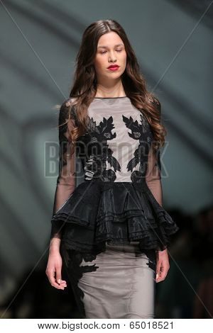 ZAGREB, CROATIA - MAY 09: Fashion model wearing clothes designed by Avaro Figlio on the Zagreb Fashion Week on May 09, 2014 in Zagreb, Croatia.