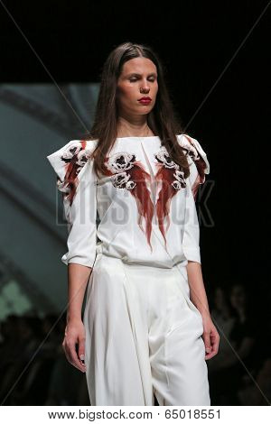 ZAGREB, CROATIA - MAY 09: Fashion model wearing clothes designed by Avaro Figlio on the Zagreb Fashion Week on May 09, 2014 in Zagreb, Croatia.