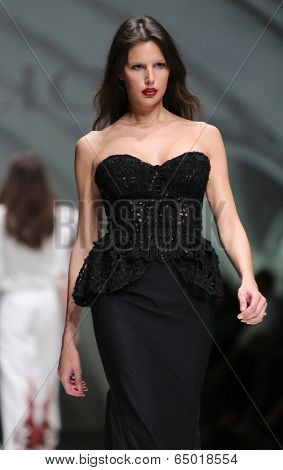ZAGREB, CROATIA - MAY 09: Fashion model wearing clothes designed by Avaro Figlio on the Zagreb Fashion Week on May 09, 2014 in Zagreb, Croatia.
