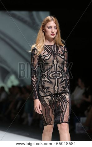 ZAGREB, CROATIA - MAY 09: Fashion model wearing clothes designed by Avaro Figlio on the Zagreb Fashion Week on May 09, 2014 in Zagreb, Croatia.