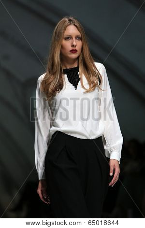 ZAGREB, CROATIA - MAY 09: Fashion model wearing clothes designed by Avaro Figlio on the Zagreb Fashion Week on May 09, 2014 in Zagreb, Croatia.