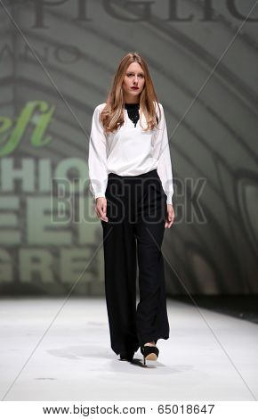 ZAGREB, CROATIA - MAY 09: Fashion model wearing clothes designed by Avaro Figlio on the Zagreb Fashion Week on May 09, 2014 in Zagreb, Croatia.