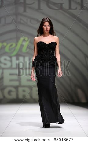 ZAGREB, CROATIA - MAY 09: Fashion model wearing clothes designed by Avaro Figlio on the Zagreb Fashion Week on May 09, 2014 in Zagreb, Croatia.