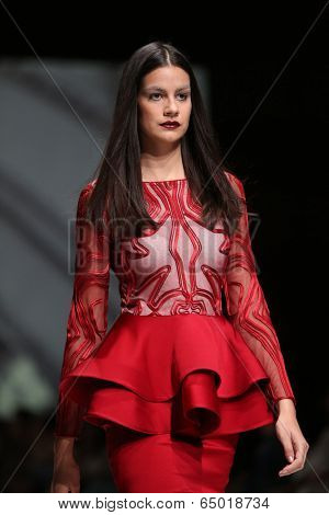 ZAGREB, CROATIA - MAY 09: Fashion model wearing clothes designed by Avaro Figlio on the Zagreb Fashion Week on May 09, 2014 in Zagreb, Croatia.