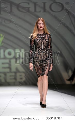 ZAGREB, CROATIA - MAY 09: Fashion model wearing clothes designed by Avaro Figlio on the Zagreb Fashion Week on May 09, 2014 in Zagreb, Croatia.