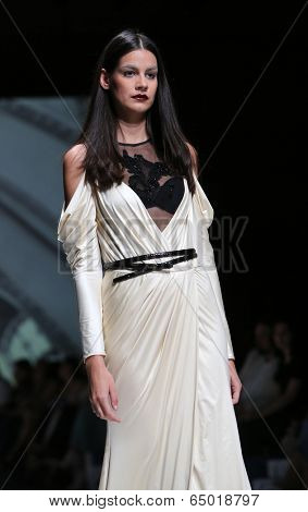 ZAGREB, CROATIA - MAY 09: Fashion model wearing clothes designed by Avaro Figlio on the Zagreb Fashion Week on May 09, 2014 in Zagreb, Croatia.
