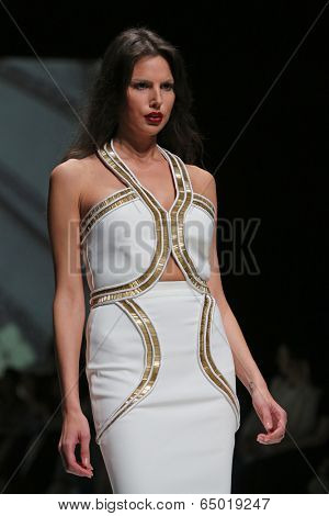 ZAGREB, CROATIA - MAY 09: Fashion model wearing clothes designed by Avaro Figlio on the Zagreb Fashion Week on May 09, 2014 in Zagreb, Croatia.