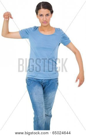 Powerless brunette in jeans and tshirt on white background