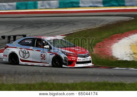 SEPANG, MALAYSIA - MAY 10, 2014: The Toyota Altis car of Chen Jian Hong takes to the track at the Thailand Super 2000 race of the Thailand Super Series Rd 1 in Sepang International Circuit.
