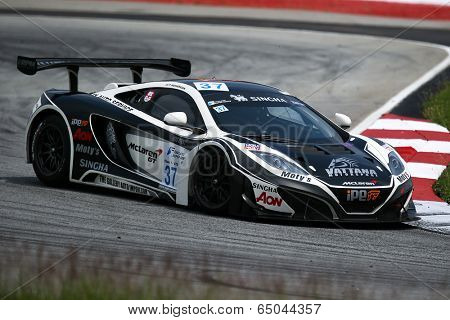 SEPANG, MALAYSIA - MAY 10, 2014: The McLaren MP4 car of Indharasak Techaterasiri takes to the track at the Thailand Supercar GT3 race of the Thailand Super Series Rd 1 in Sepang International Circuit.