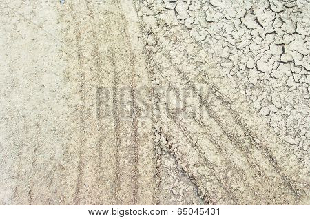 Tire Mark In Cracked Soil.