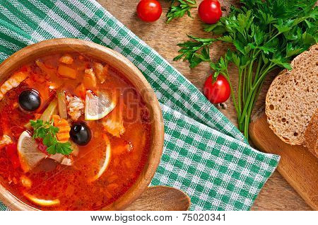 Soup solyanka Russian with meat, olives and gherkins