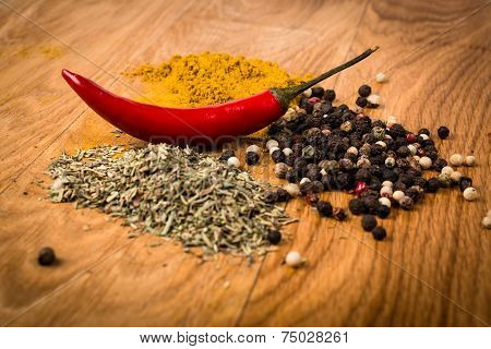 Fresh and dried hot chili peppers witn herbs, spices