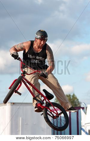 Man Spins His Bike In Midair Performing At Bmx Show