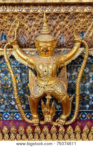Golden ornamental buddhist figure in Bangkok