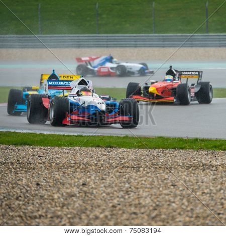 ASSEN, NETHERLANDS - OCTOBER 19, 2014: Formula FA1 cars druing the warm up lap of the final wet race of the Acceleration 2014 tour