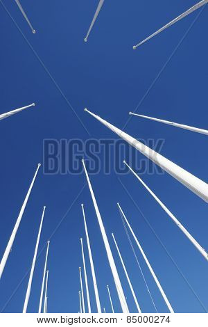 Masts no flag and clear blue sky.