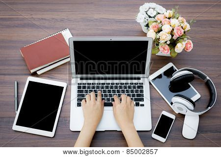 Closeup of business woman hand typing on laptop keyboard
