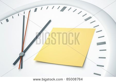 An image of a bright clock with a sticky note