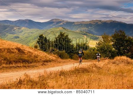 Father And Son With Mountain Bikes.