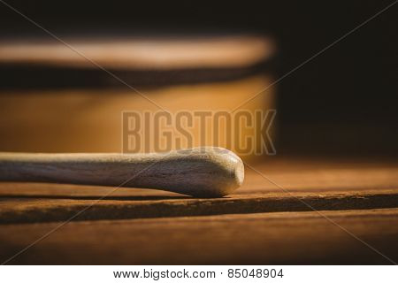 Traditional Irish bodhran and stick on wooden table